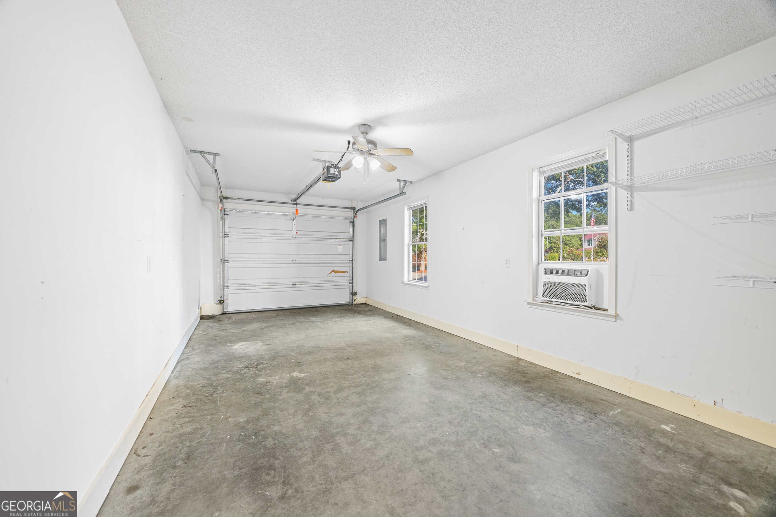 108 Crossing Circle Rincon, GA 31326 - Photo 11 of 26 an empty room with windows and ceiling fan