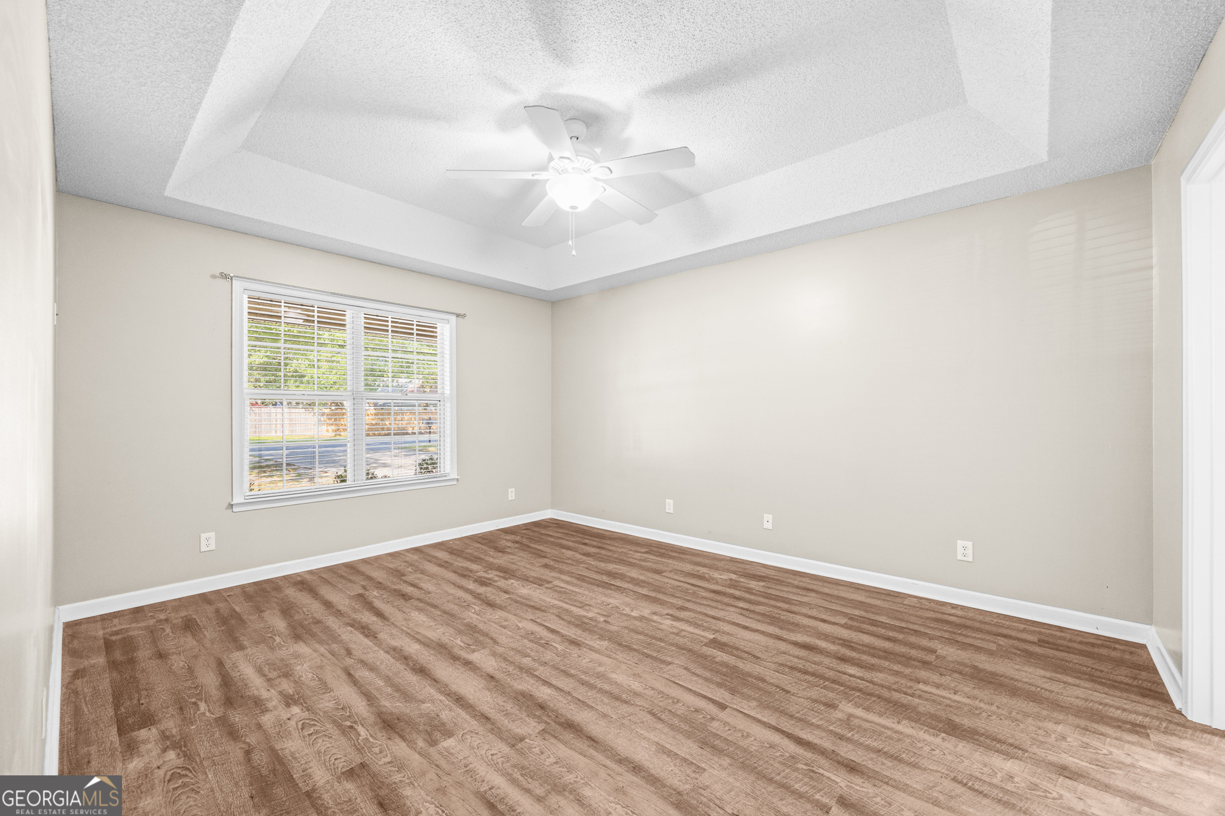 108 Crossing Circle Rincon, GA 31326 - Photo 18 of 26 an empty room with wooden floor fan and windows