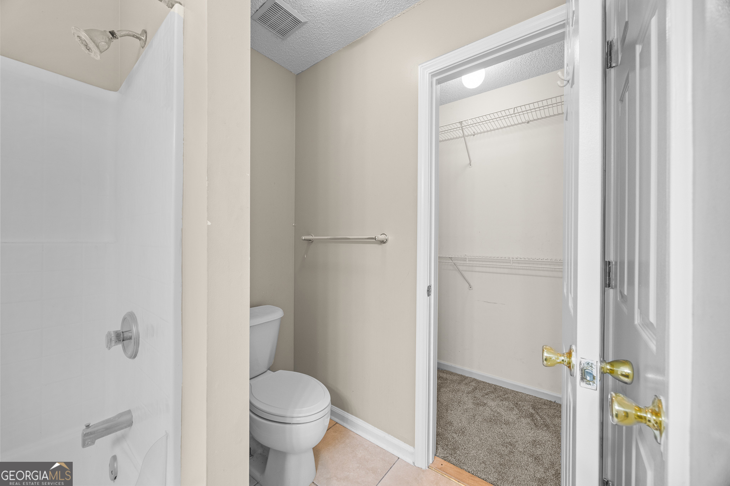 108 Crossing Circle Rincon, GA 31326 - Photo 21 of 26 a bathroom with a granite countertop toilet and a sink