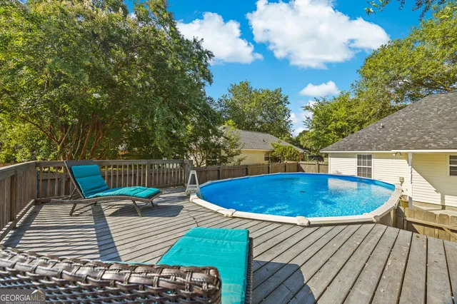 a view of a swimming pool with a patio