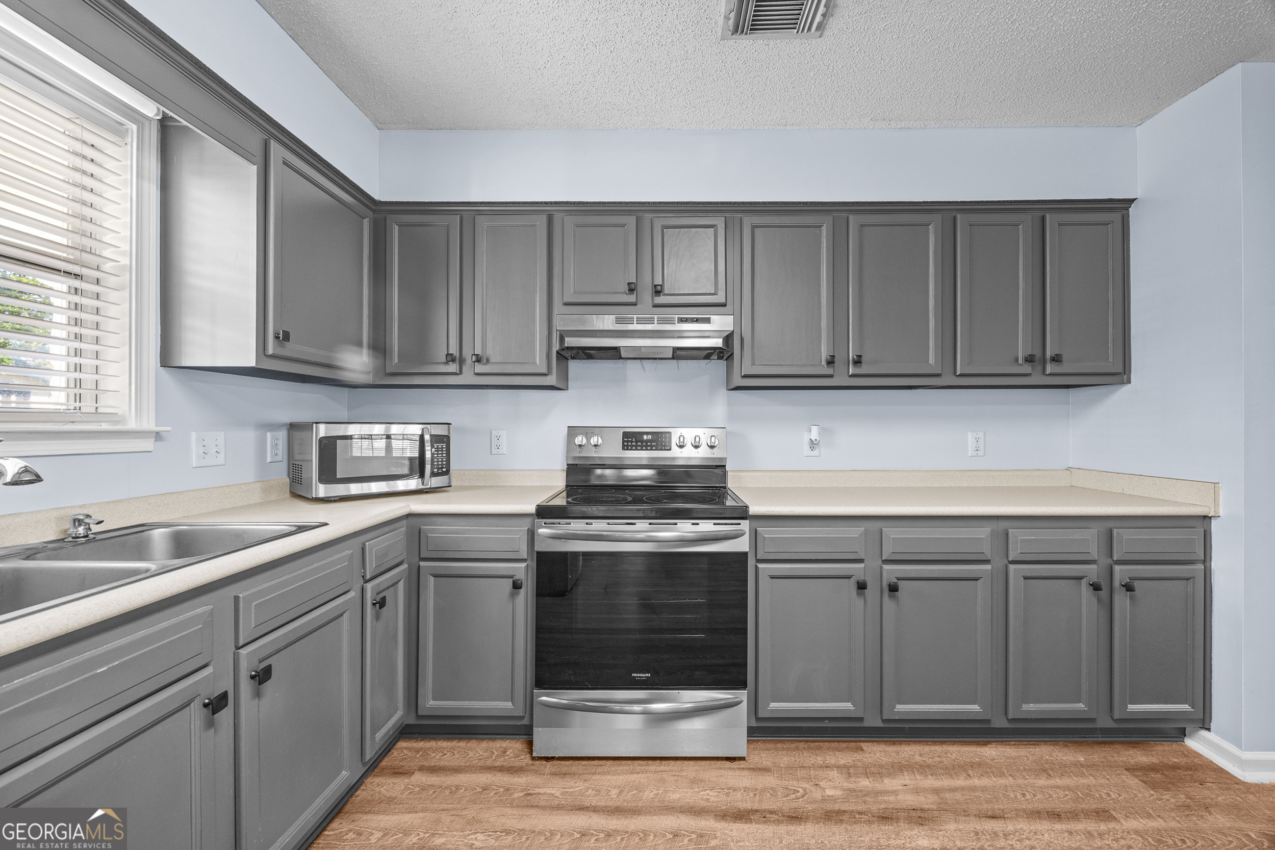 108 Crossing Circle Rincon, GA 31326 - Photo 8 of 26 a kitchen with appliances cabinets and a sink