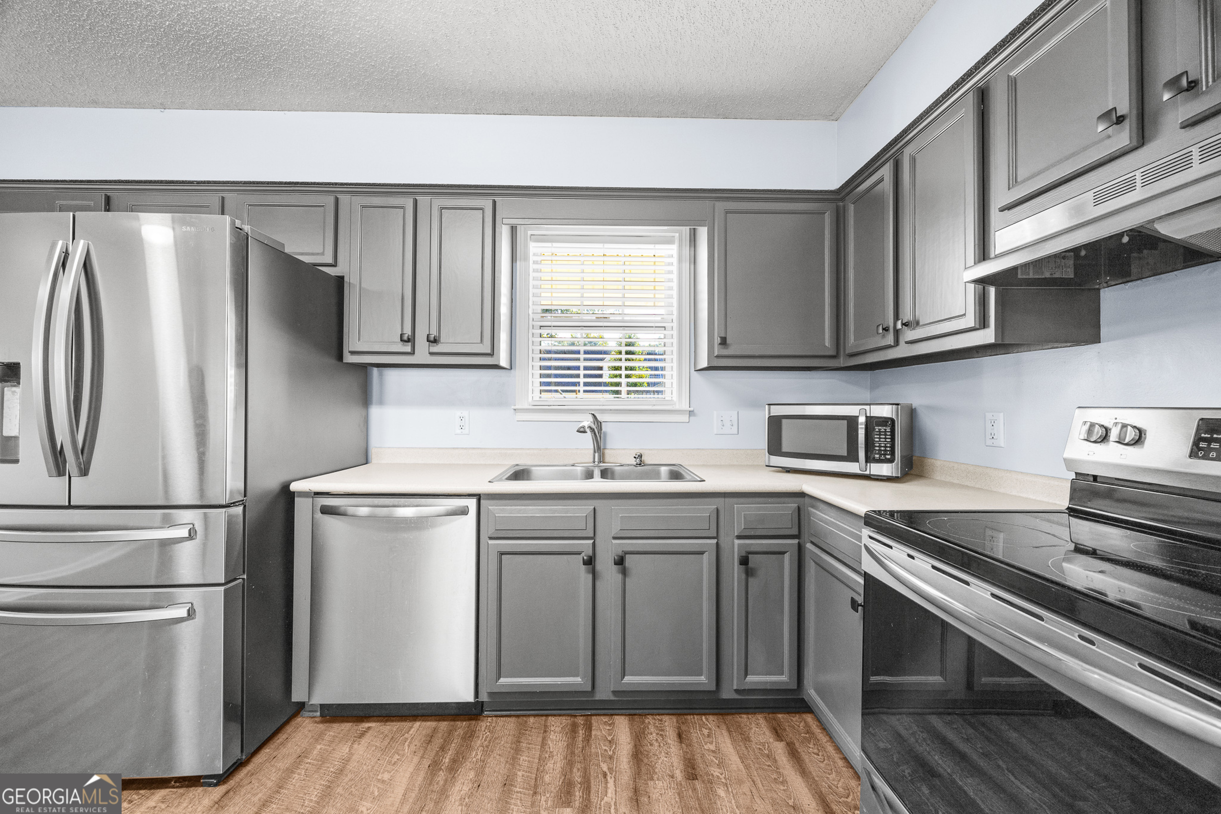 108 Crossing Circle Rincon, GA 31326 - Photo 9 of 26 a kitchen with a sink stove and refrigerator