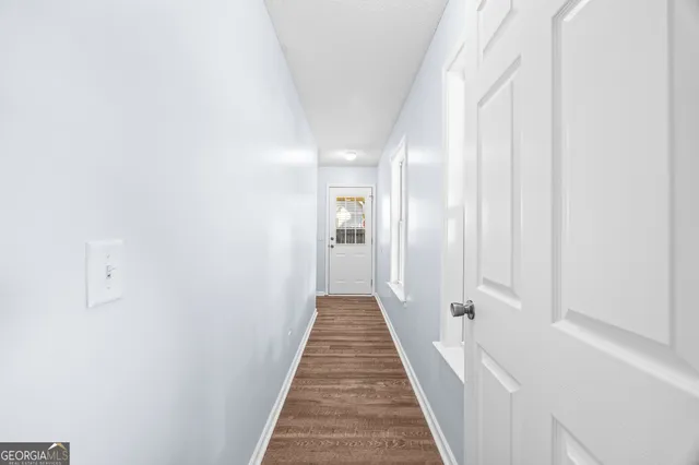 a view of a hallway with a white walls