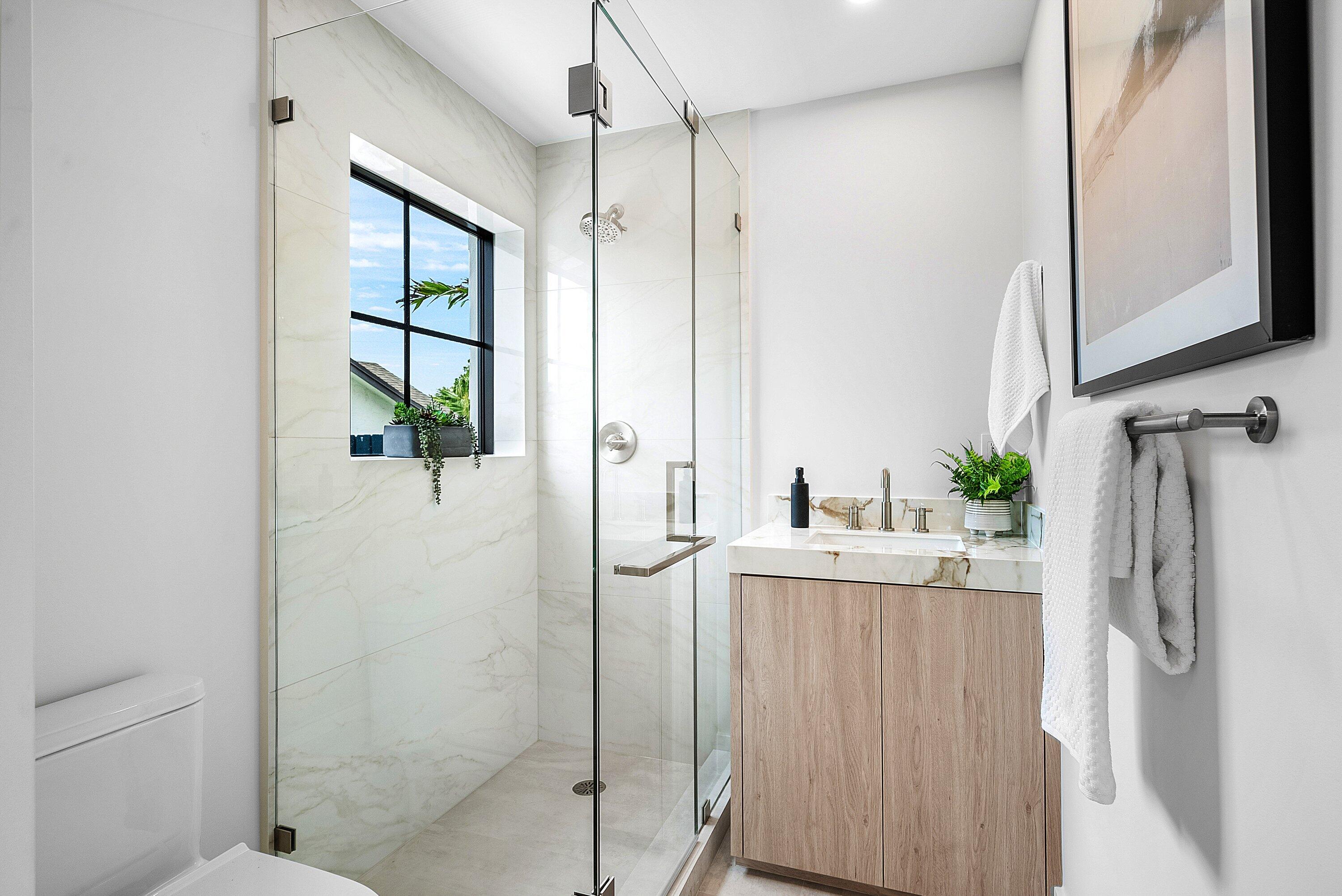 478 Northwest 13th Street Boca Raton, FL 33432 - Photo 16 of 38 a bathroom with a shower and a sink