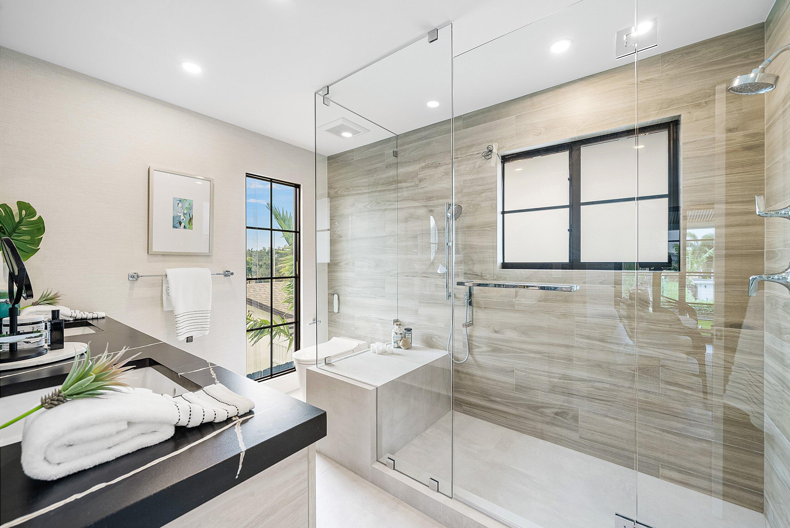 478 Northwest 13th Street Boca Raton, FL 33432 - Photo 22 of 38 a bathroom with a tub sink and mirror