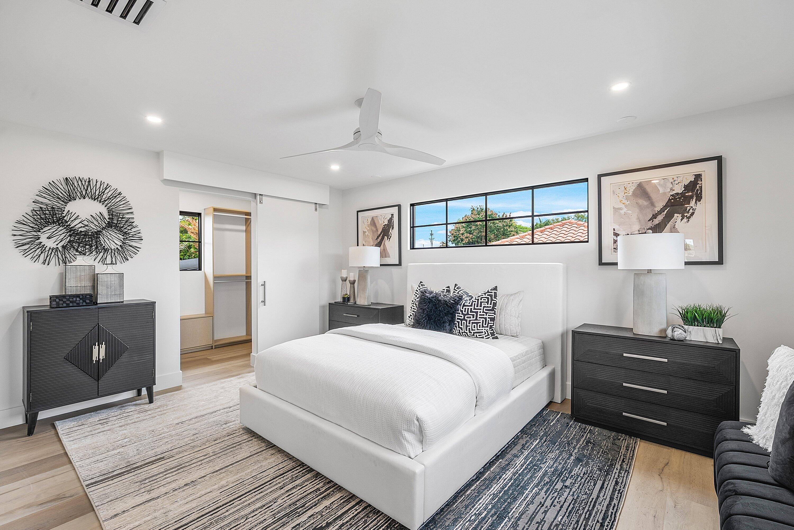 478 Northwest 13th Street Boca Raton, FL 33432 - Photo 26 of 38 a bedroom with a bed and window