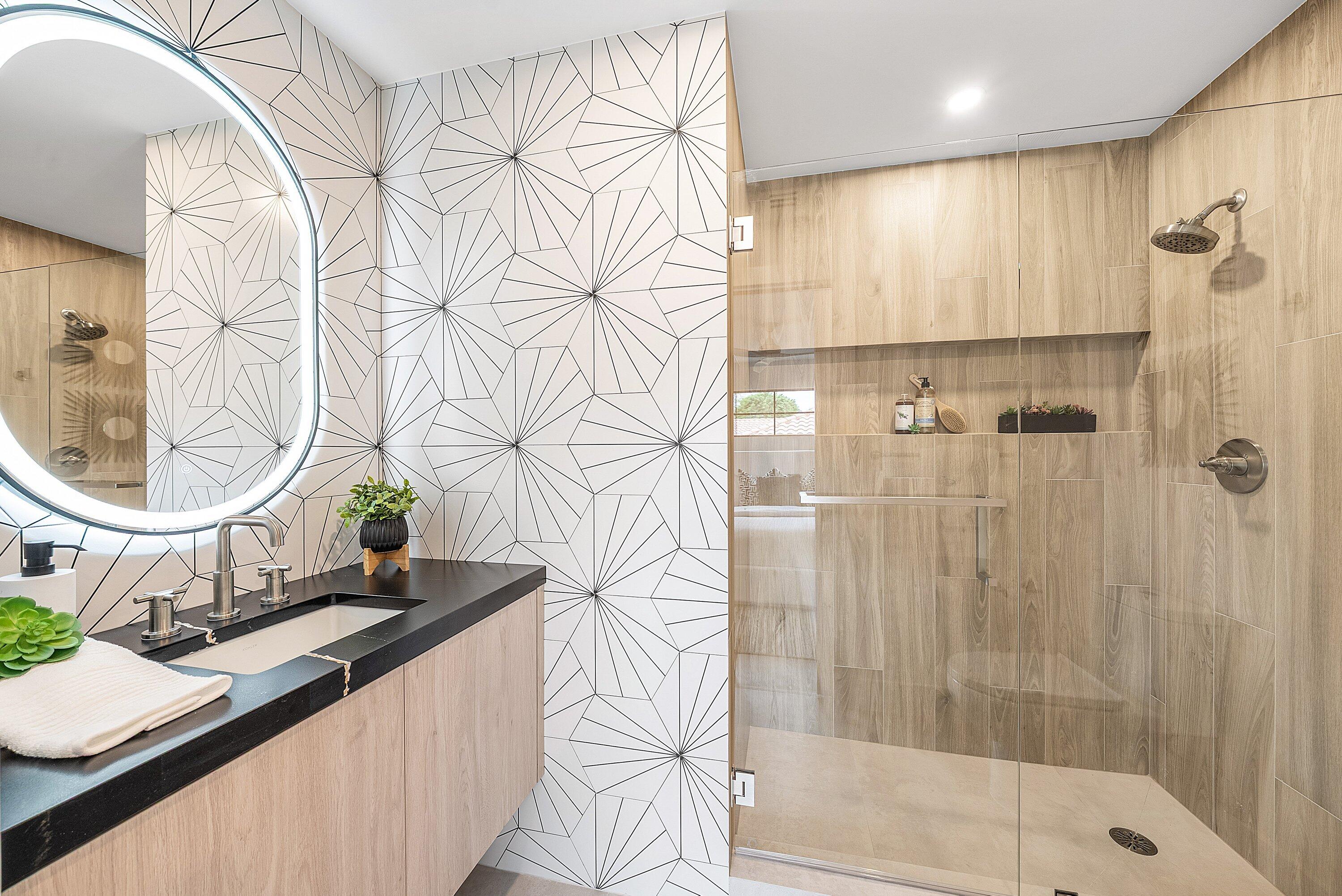 478 Northwest 13th Street Boca Raton, FL 33432 - Photo 28 of 38 a bathroom with a sink a mirror and a shower