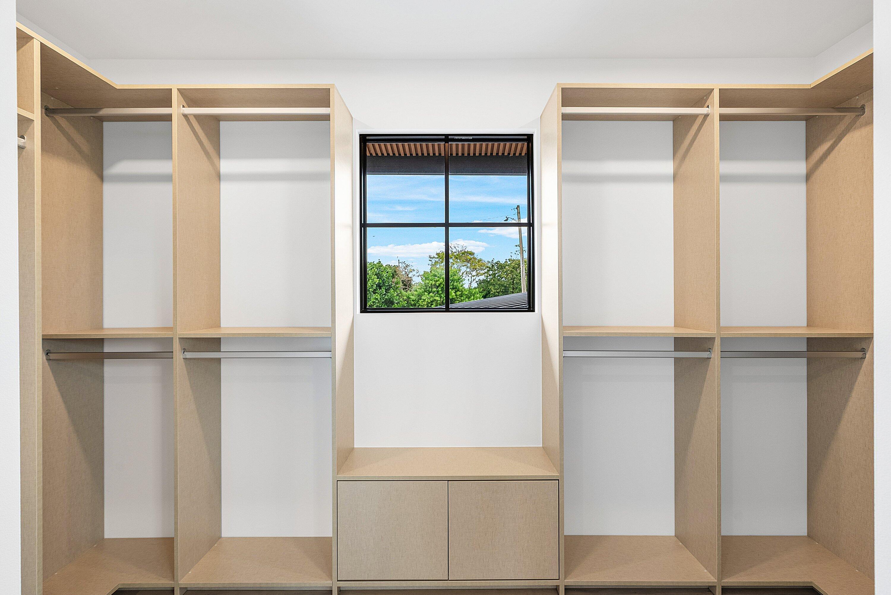 478 Northwest 13th Street Boca Raton, FL 33432 - Photo 29 of 38 a view of walk in closet with empty racks