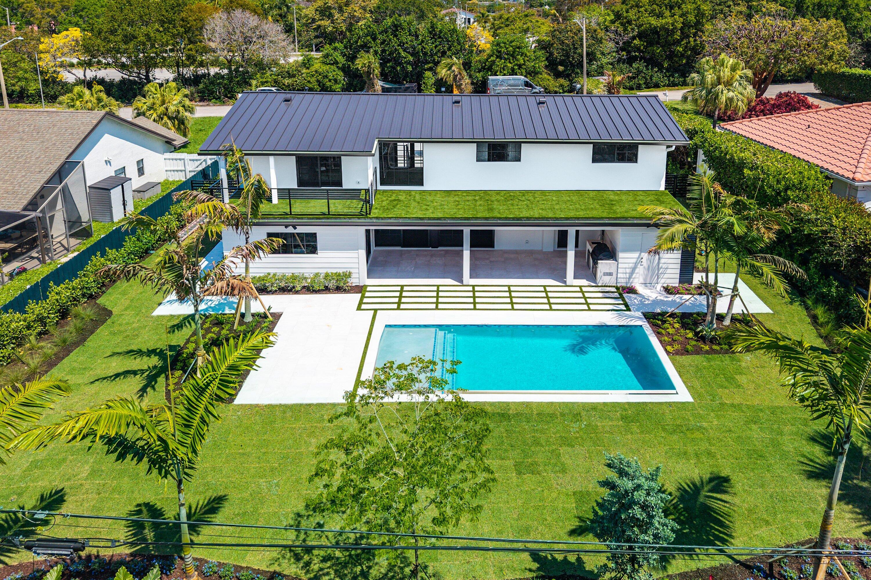 478 Northwest 13th Street Boca Raton, FL 33432 - Photo 35 of 38 a view of a swimming pool with potted plants