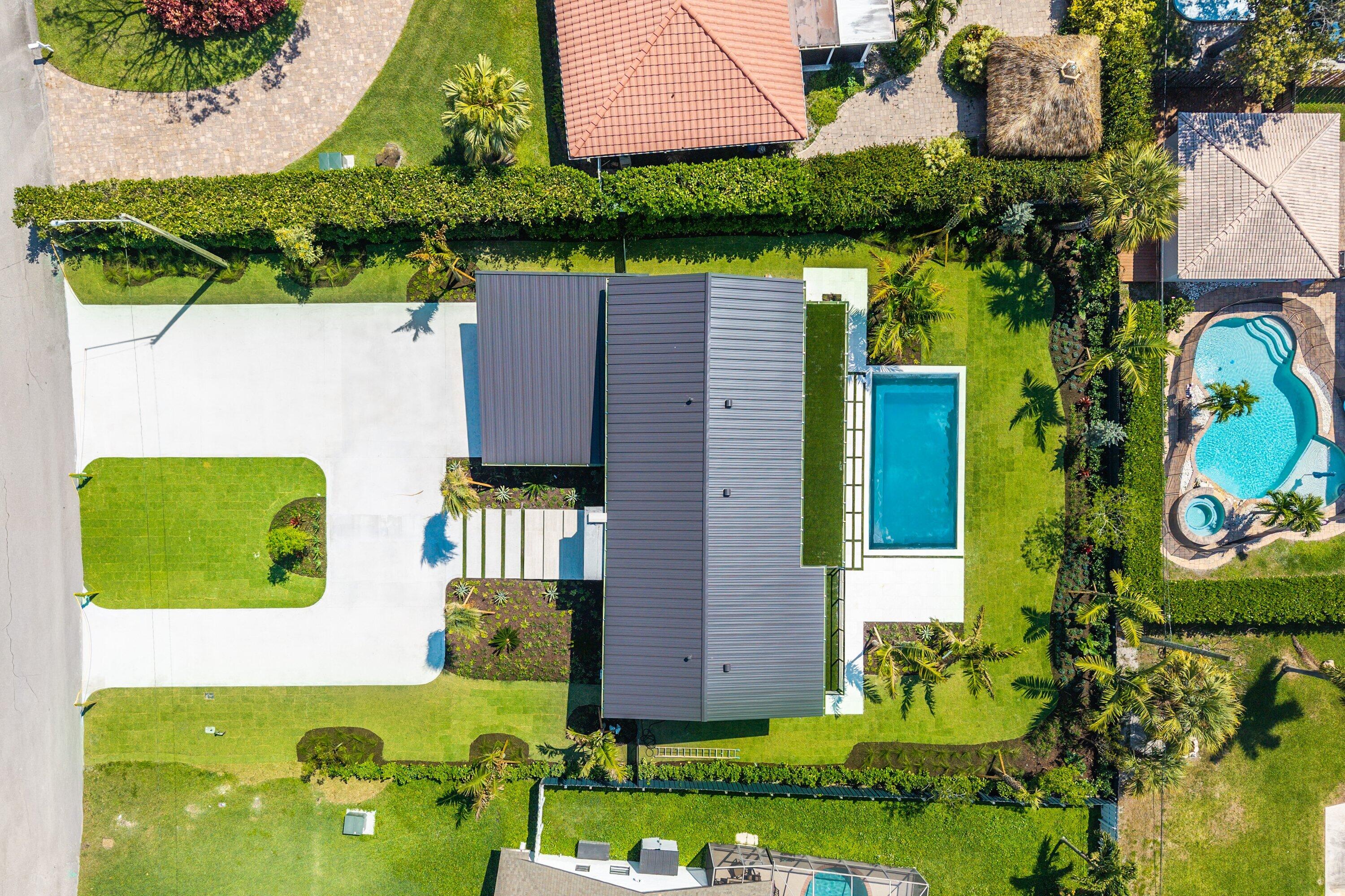 478 Northwest 13th Street Boca Raton, FL 33432 - Photo 36 of 38 an aerial view of a house with a swimming pool outdoor seating and yard