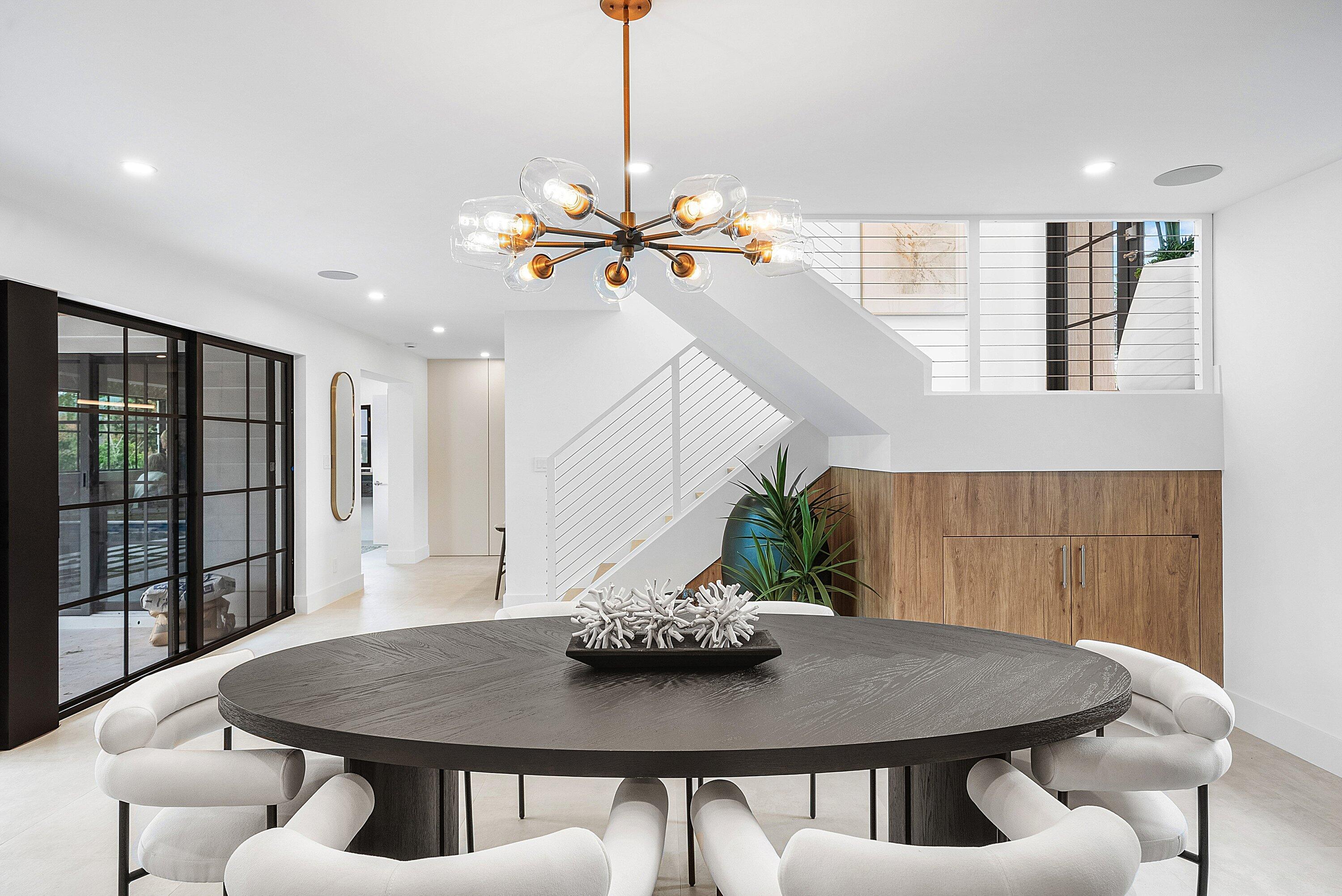 478 Northwest 13th Street Boca Raton, FL 33432 - Photo 7 of 38 a view of a dining room with furniture and a chandelier