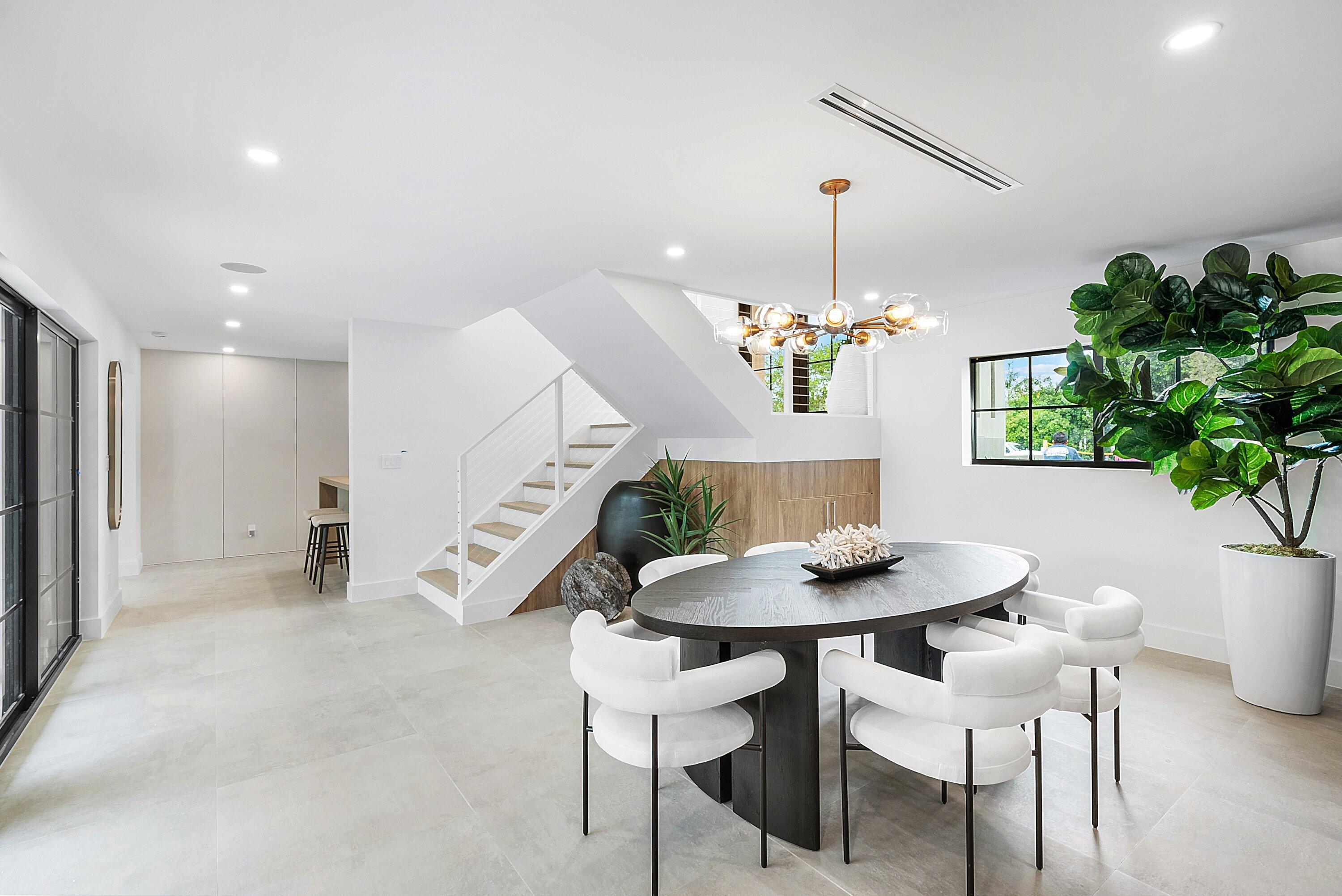 478 Northwest 13th Street Boca Raton, FL 33432 - Photo 8 of 38 a dining room with furniture and a chandelier