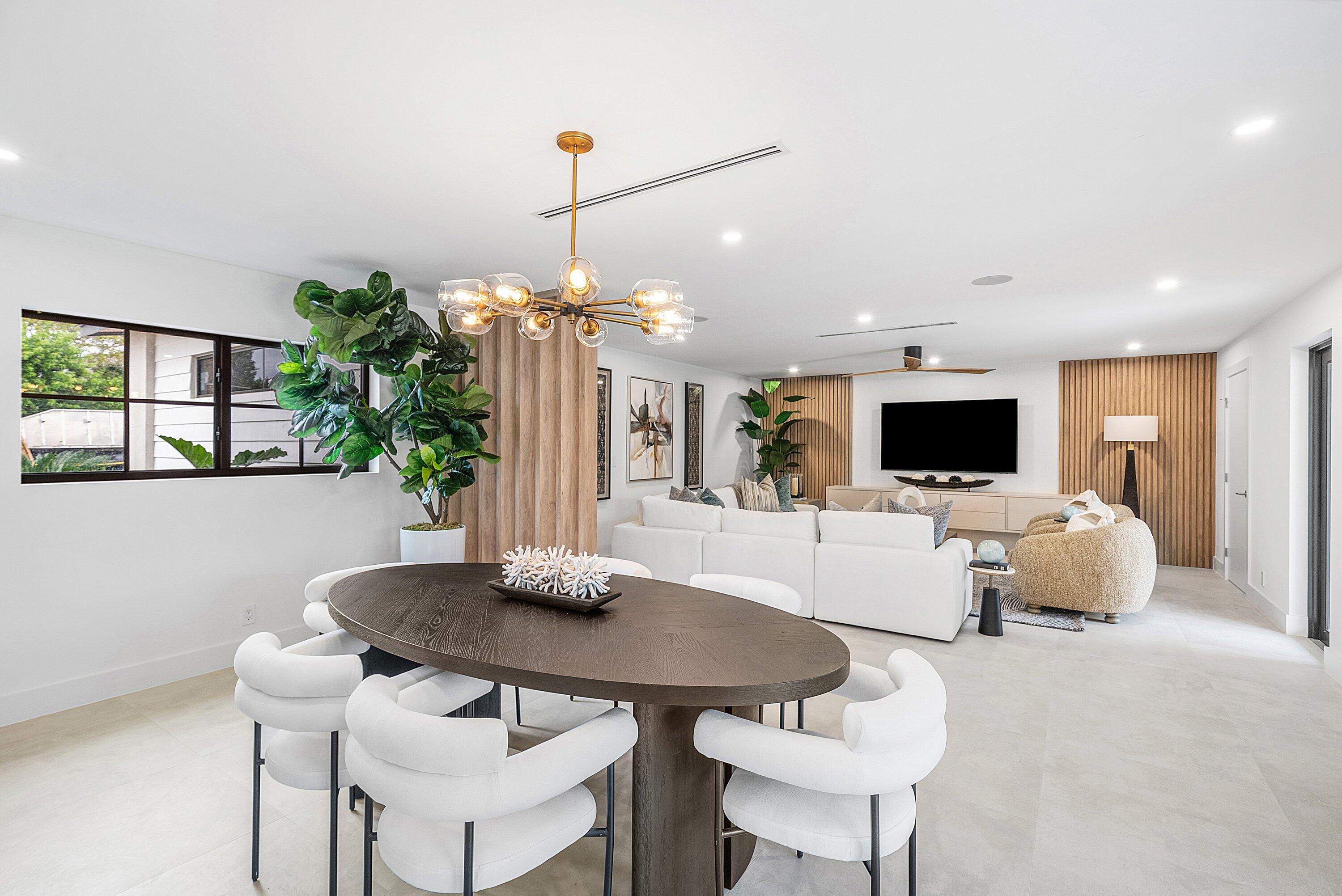 478 Northwest 13th Street Boca Raton, FL 33432 - Photo 9 of 38 a living room with furniture a flat screen tv and a large window