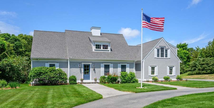 80 Old Kings Road Cotuit, MA 02635 - Photo 3 of 47 a front view of a house with a yard