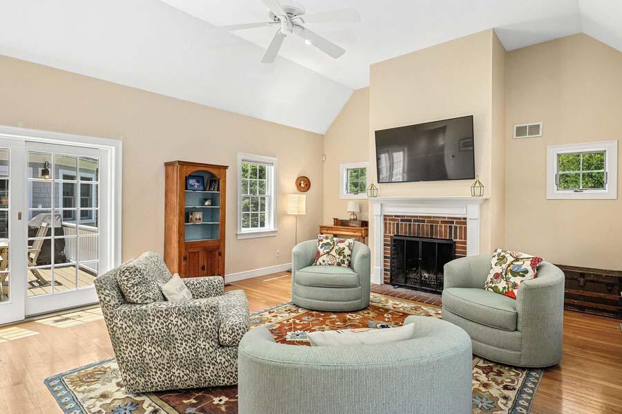 80 Old Kings Road Cotuit, MA 02635 - Photo 8 of 47 a living room with furniture and a fireplace