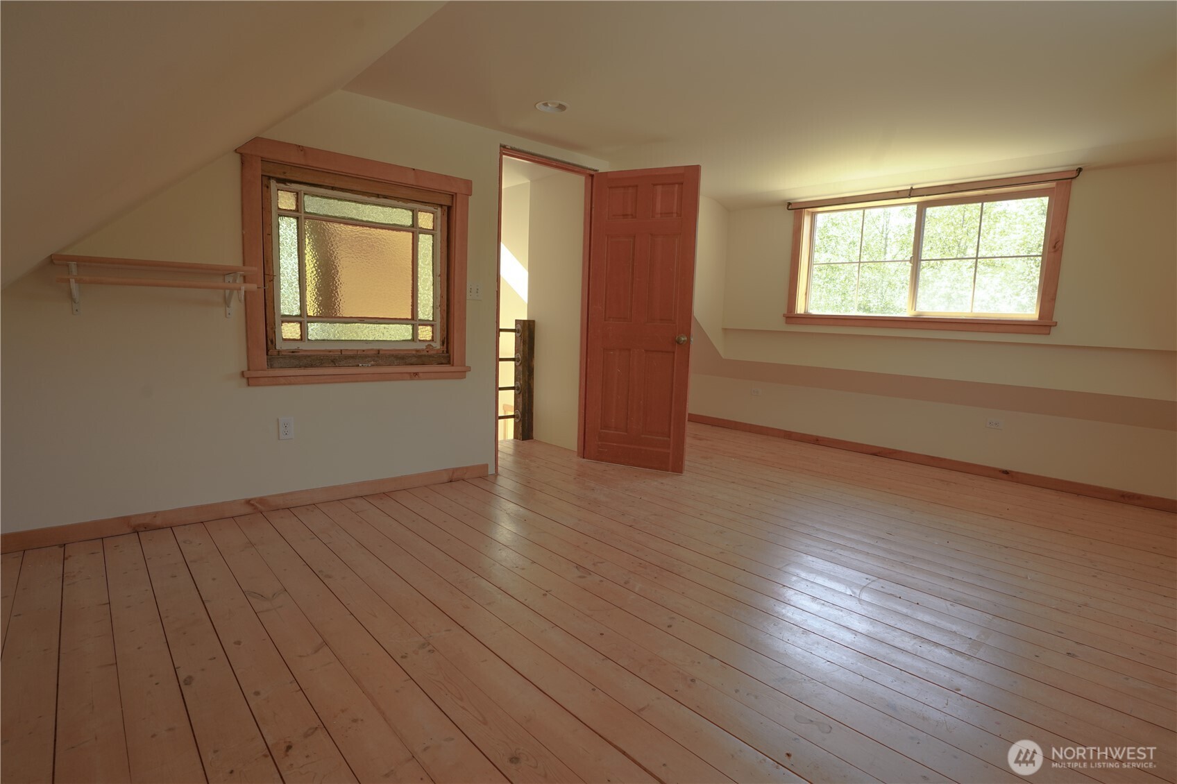 2904 Wildwood Road Quilcene, WA 98376 - Photo 10 of 39 a view of an empty room with wooden floor and a window