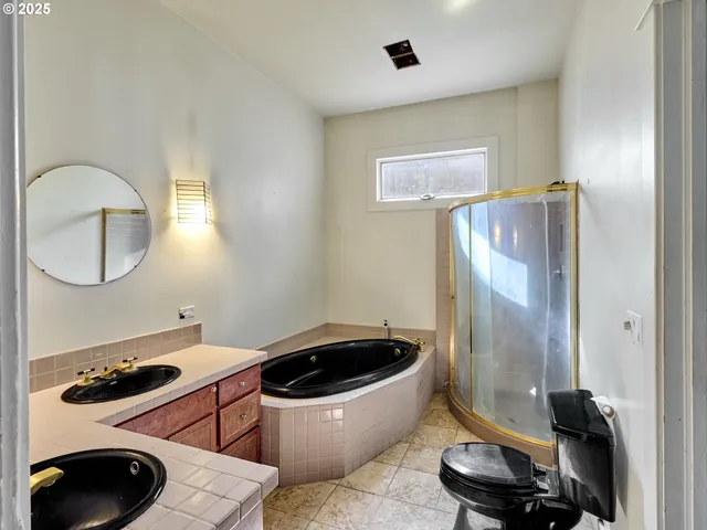 a bathroom with a sink a mirror and a shower
