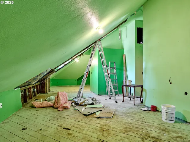 a view of swimming pool with lawn chairs and couches