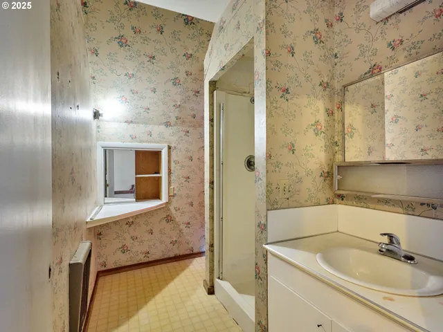 a bathroom with a sink and a mirror