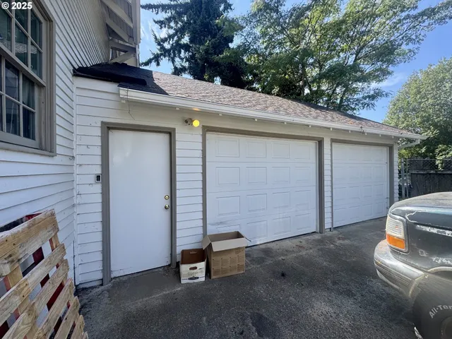 a side view of a house with a garage