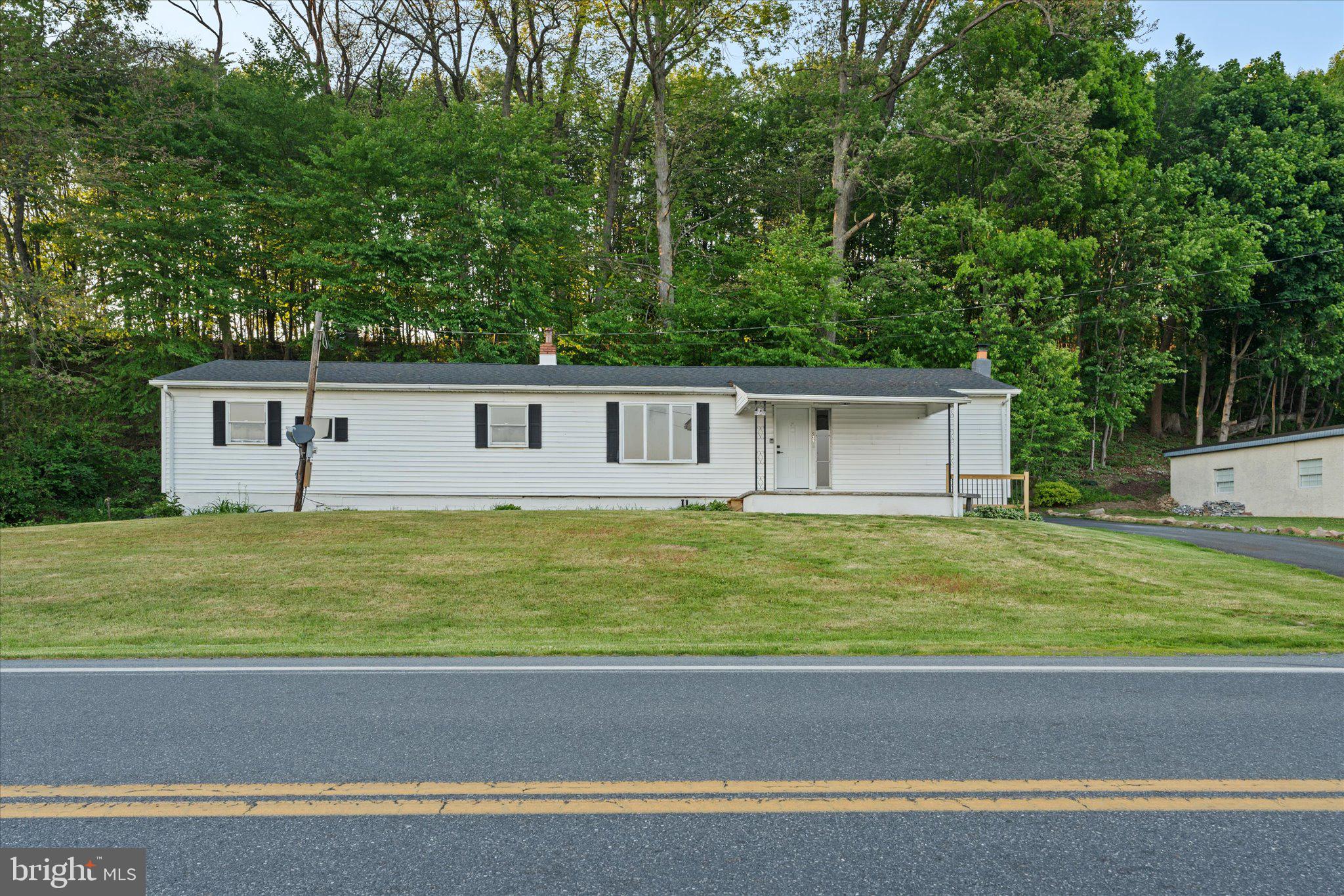 831 Deturksville Road Pine Grove, PA 17963 - Photo 1 of 24 a view of a house with a swimming pool