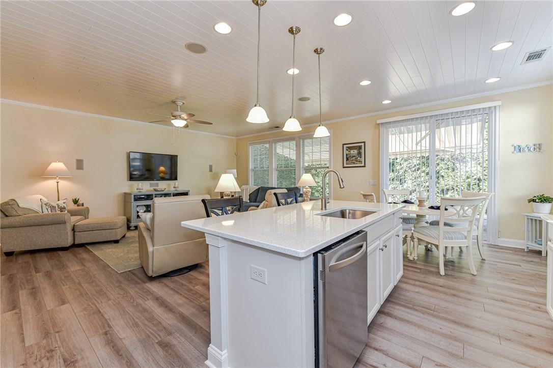 1223 Gold Rush Court Fort Mill, SC 29708 - Photo 11 of 39 a large kitchen with stainless steel appliances a lot of counter space and a wooden floor