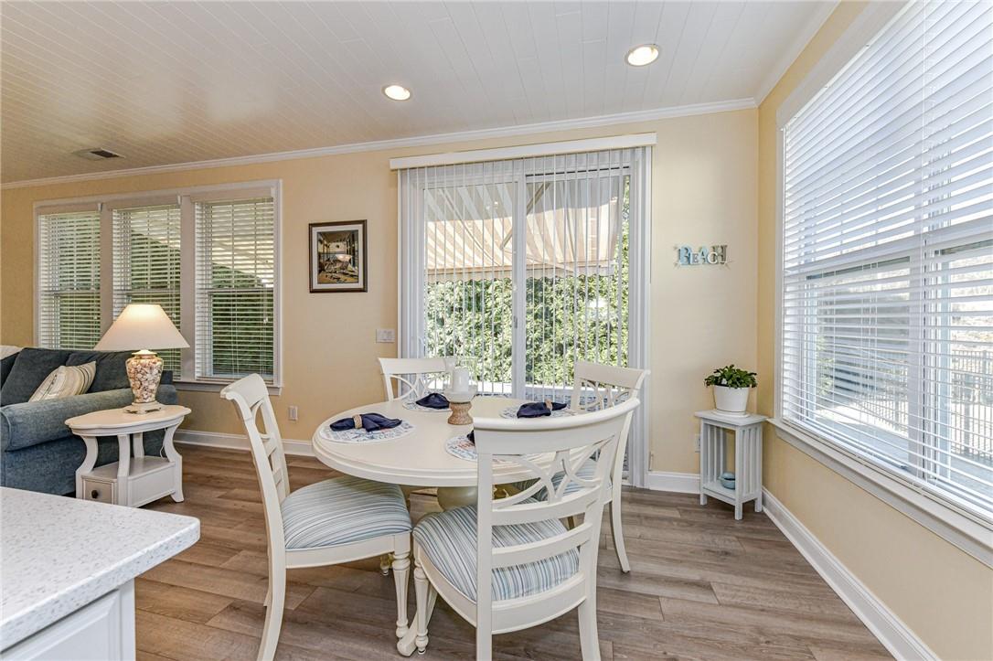 1223 Gold Rush Court Fort Mill, SC 29708 - Photo 15 of 39 a view of a dining room with furniture large windows and wooden floor