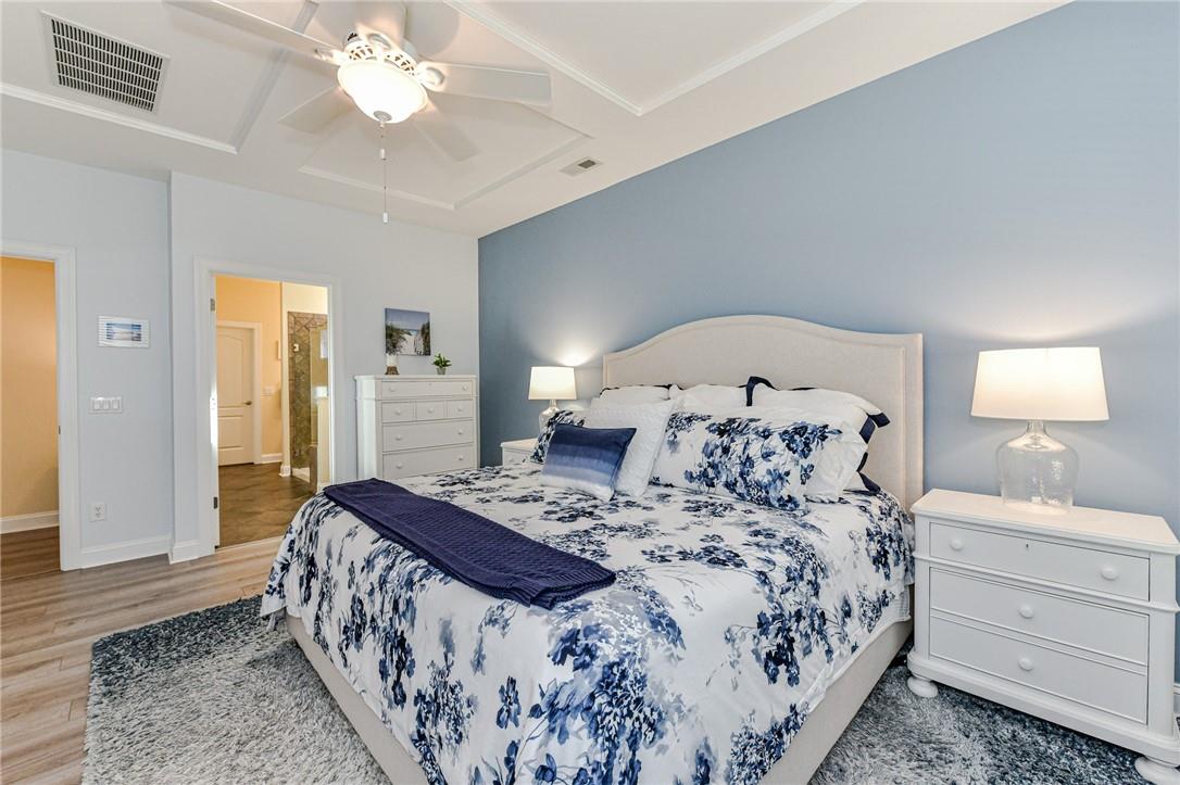 1223 Gold Rush Court Fort Mill, SC 29708 - Photo 18 of 39 a bedroom with a large bed and a mirror