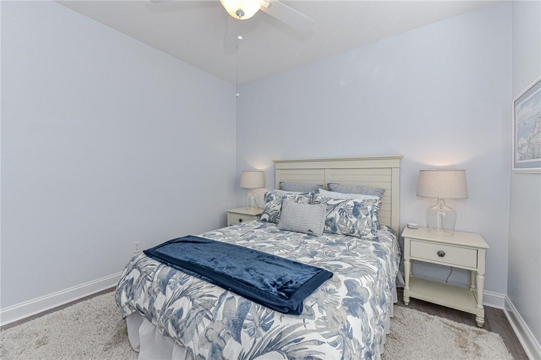 1223 Gold Rush Court Fort Mill, SC 29708 - Photo 24 of 39 a bedroom with a bed and a lamp