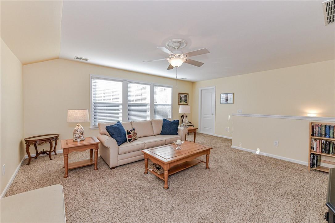 1223 Gold Rush Court Fort Mill, SC 29708 - Photo 29 of 39 a living room with furniture and a large window