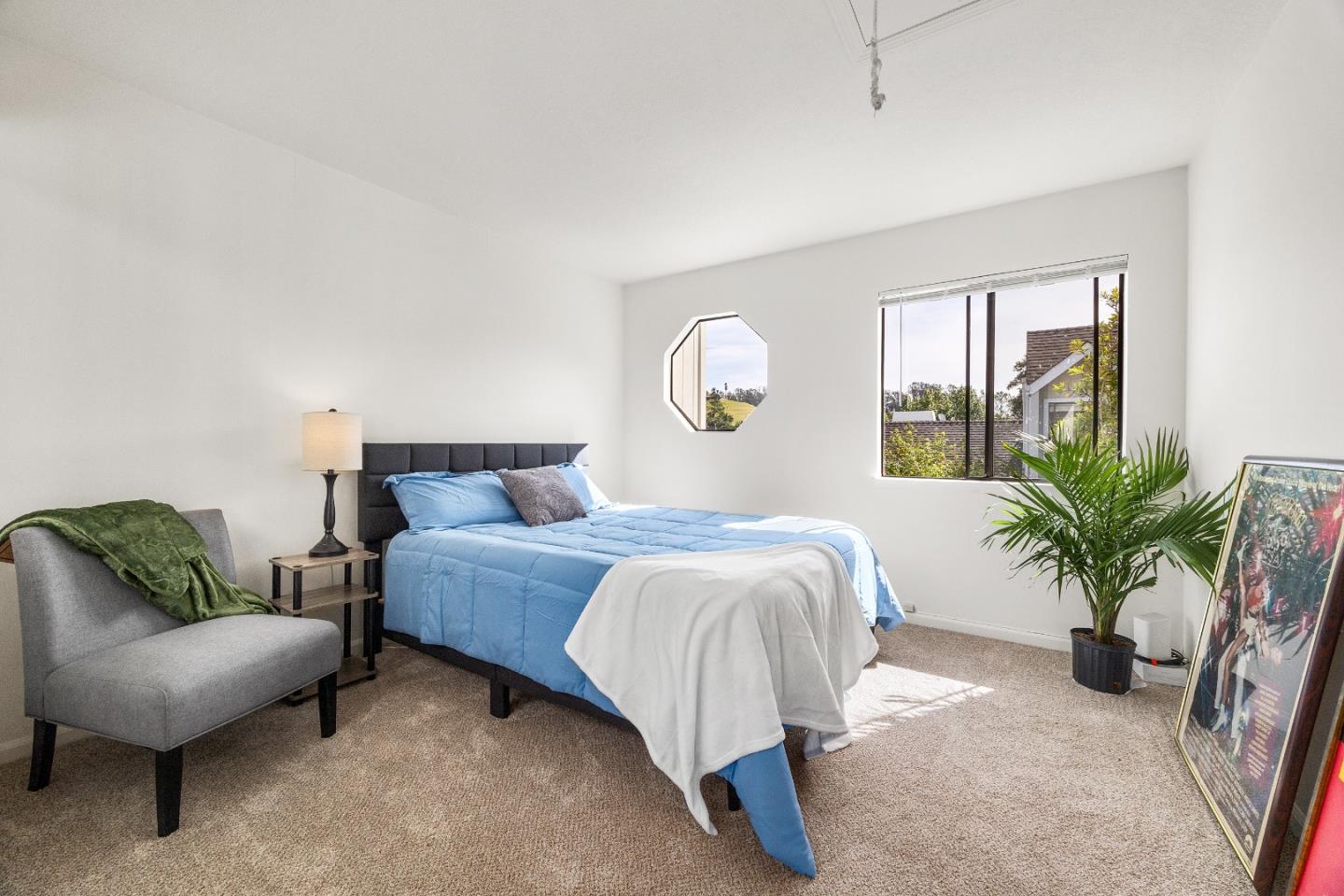 3205 Stockbridge Lane Santa Cruz, CA 95065 - Photo 14 of 30 a spacious bedroom with a bed and a couch