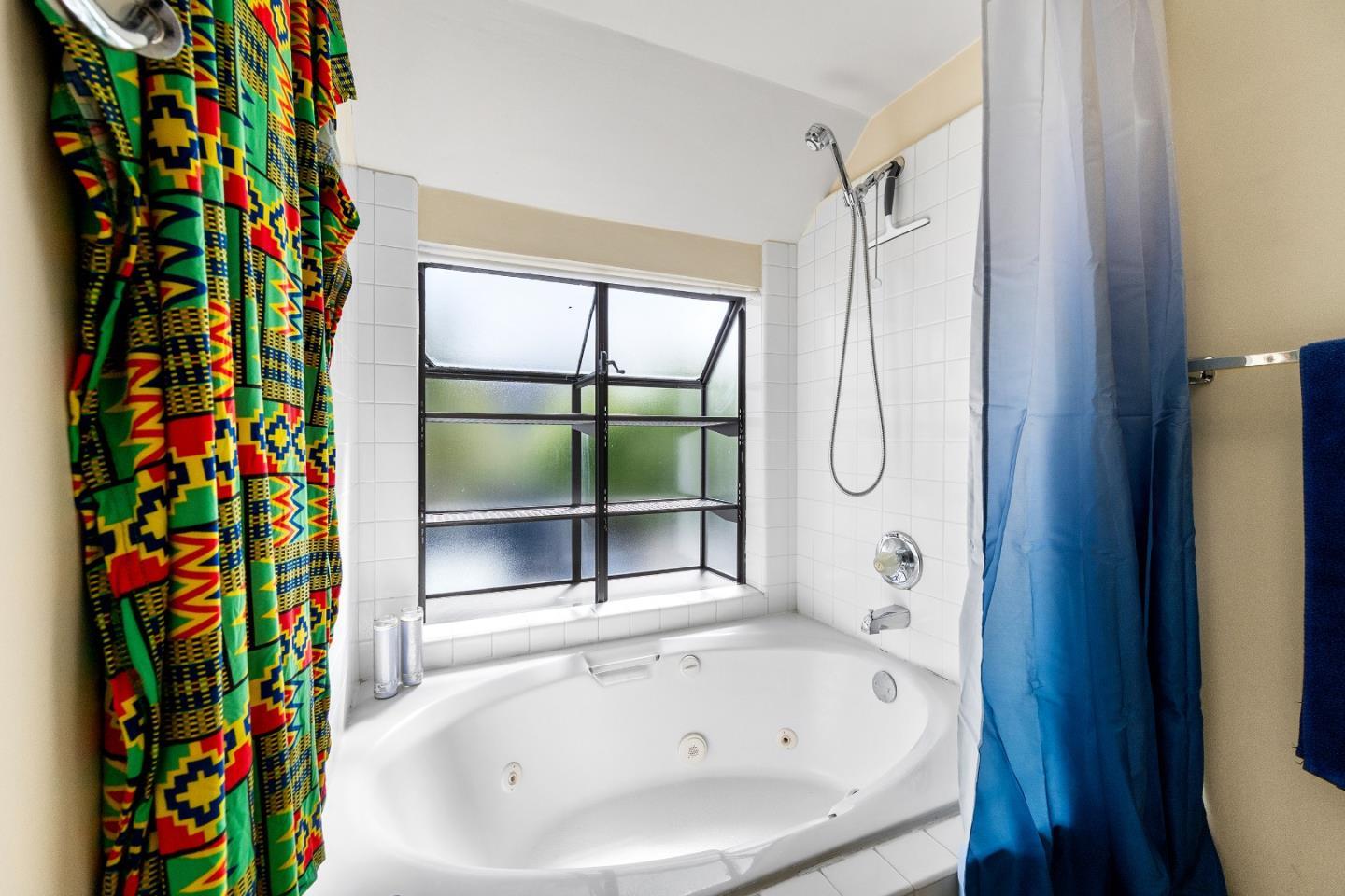 3205 Stockbridge Lane Santa Cruz, CA 95065 - Photo 23 of 30 a bathroom with a bathtub and a shower curtain