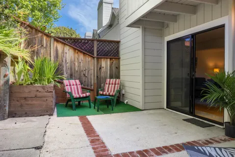 a backyard of a house with seating space