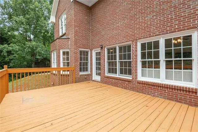 a view of a house with wooden floor and fence