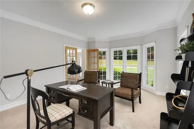 a living room with furniture a flat screen tv and a large window