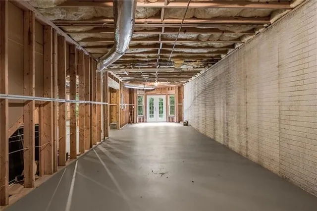 a view of a room with wooden walls