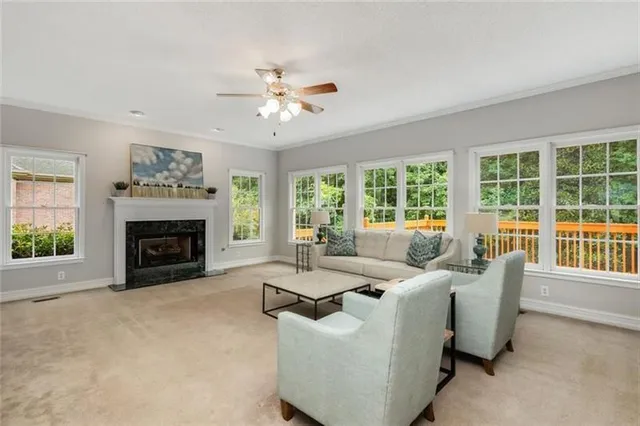 a living room with furniture and a fireplace