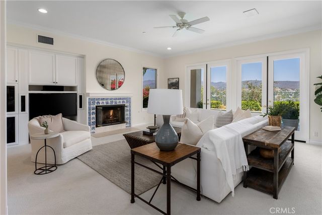 a kitchen with granite countertop white cabinets and stainless steel appliances