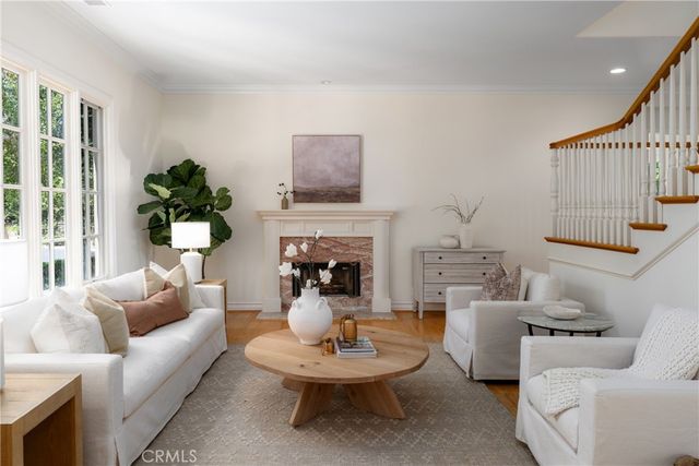 a bedroom with a bed lamp and a large window