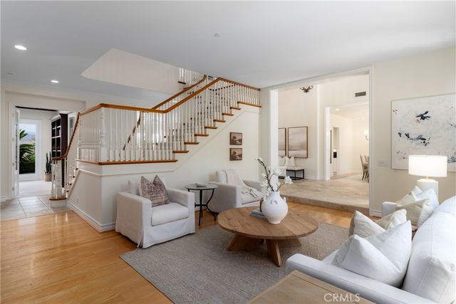 a living room with furniture and fireplace