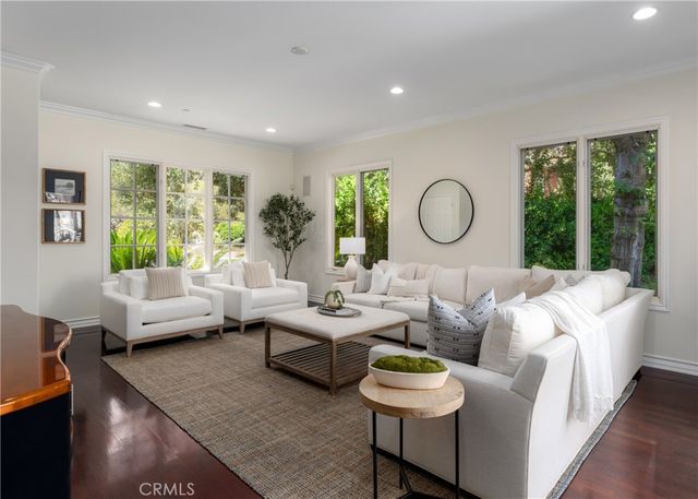 a spacious bathroom with a tub sink and mirror