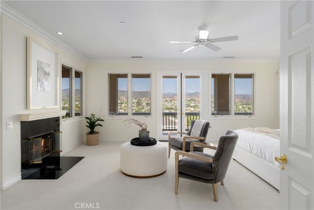 a view of a house with yard and sitting area