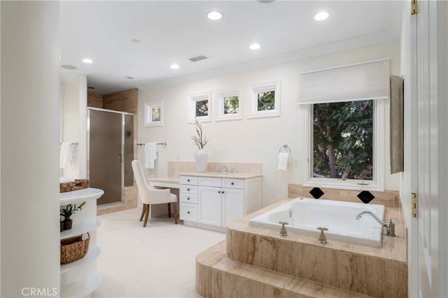 a front view of a house with a yard and a garage