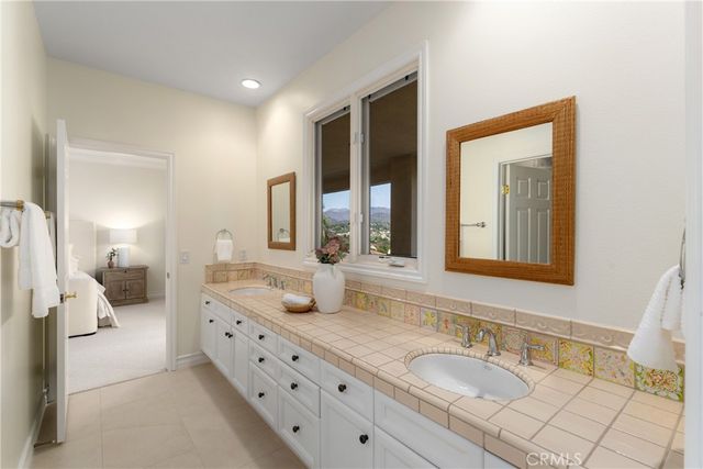 a view of street with a house in the background