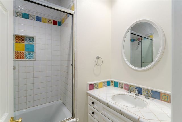 a view of a yard with plants and trees