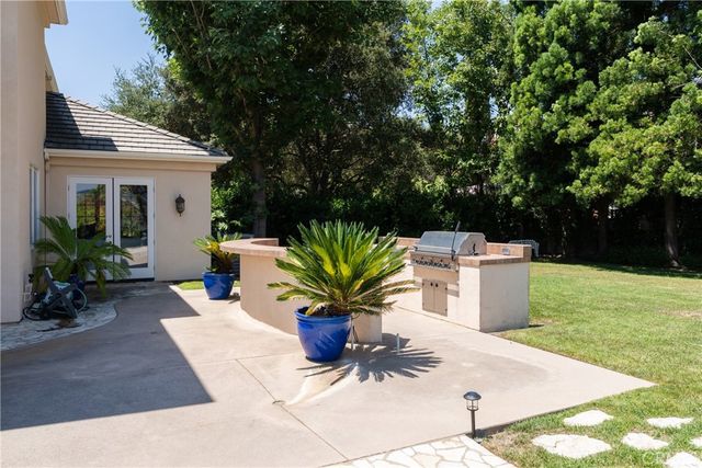 an aerial view of a house with a yard and garden