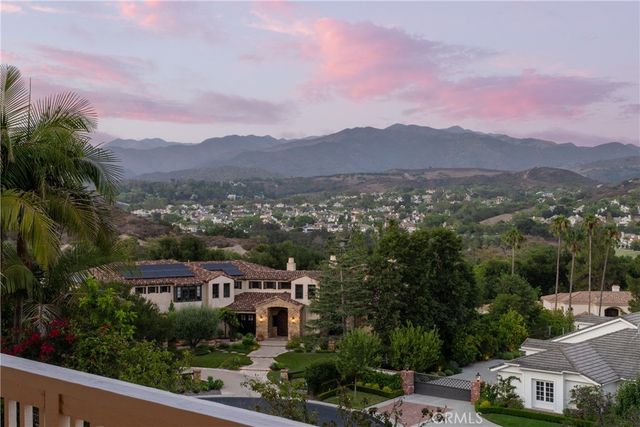 a view of living room with furniture and a clock