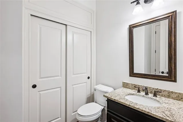 a open kitchen with stainless steel appliances granite countertop a stove and a refrigerator