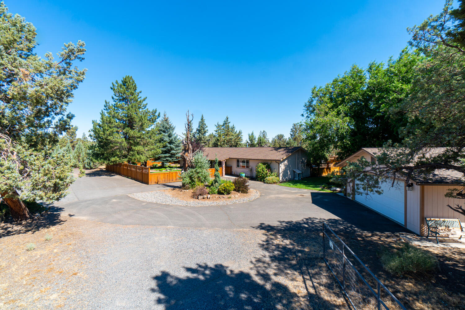 2218 Southwest 79th Street Redmond, OR 97756 - Photo 34 of 54 a view of a house with backyard and sitting area