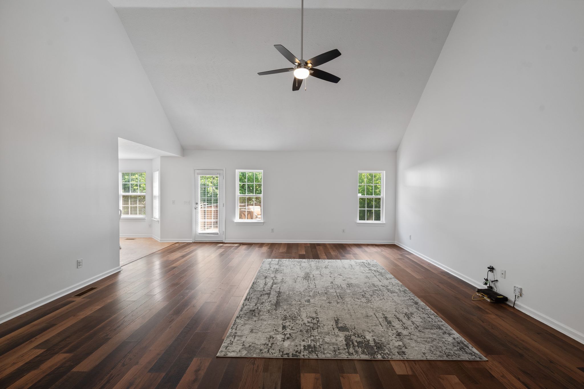 4223 Birmingham Road Lebanon, TN 37090 - Photo 5 of 30 an empty room with wooden floor fan and windows